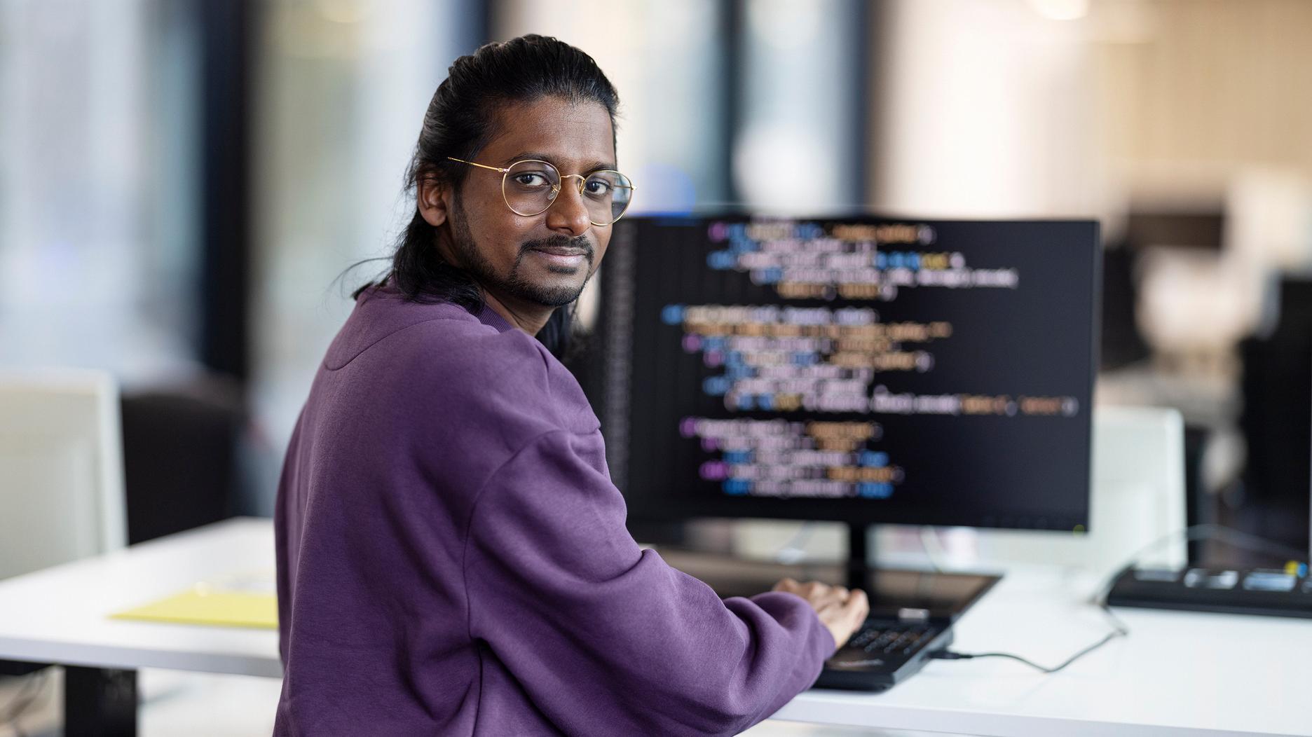 Man in front of a screen